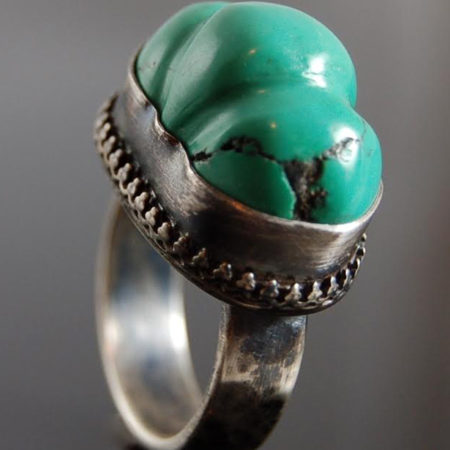 handcrafted ring with large green stone